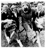 Photograph of the Nittany Lion with cheerleaders in the 1960s