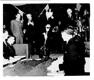 President Hetzel turns a symbolic shovel of earth at building dedication ceremonies, February 26, 1938. 