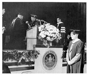 George H. Deike presenting the University mace to Eric Walker at his 1956 inaugural. 