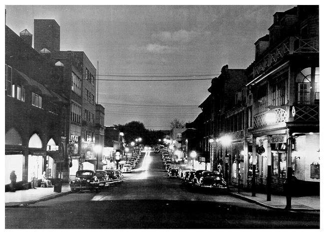 old b&w photograph of South Allen Street at night